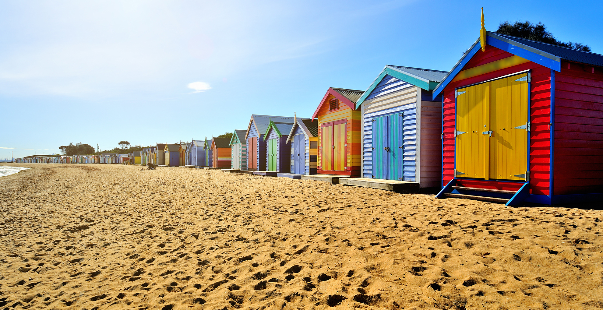 the Iconic Melbourne Beach Boxes on the Mornington Peninsula in Victoria, a beautiful beach day with views to the port phillip bay and potentially over to the Melbourne CBD