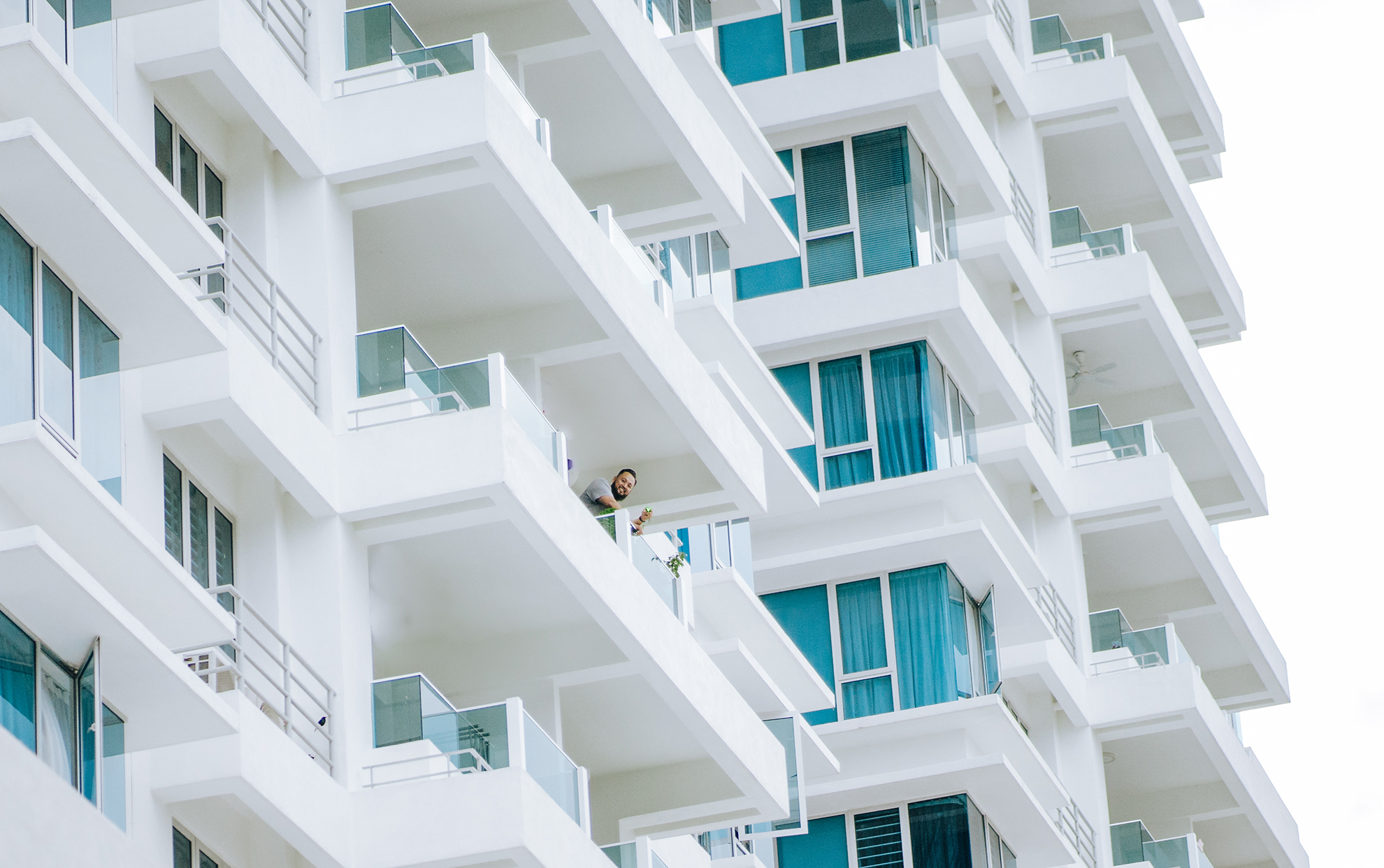 image of a beautiful white boutique residentual apartment building, over 7 storeys high, in the springtime, Victoria