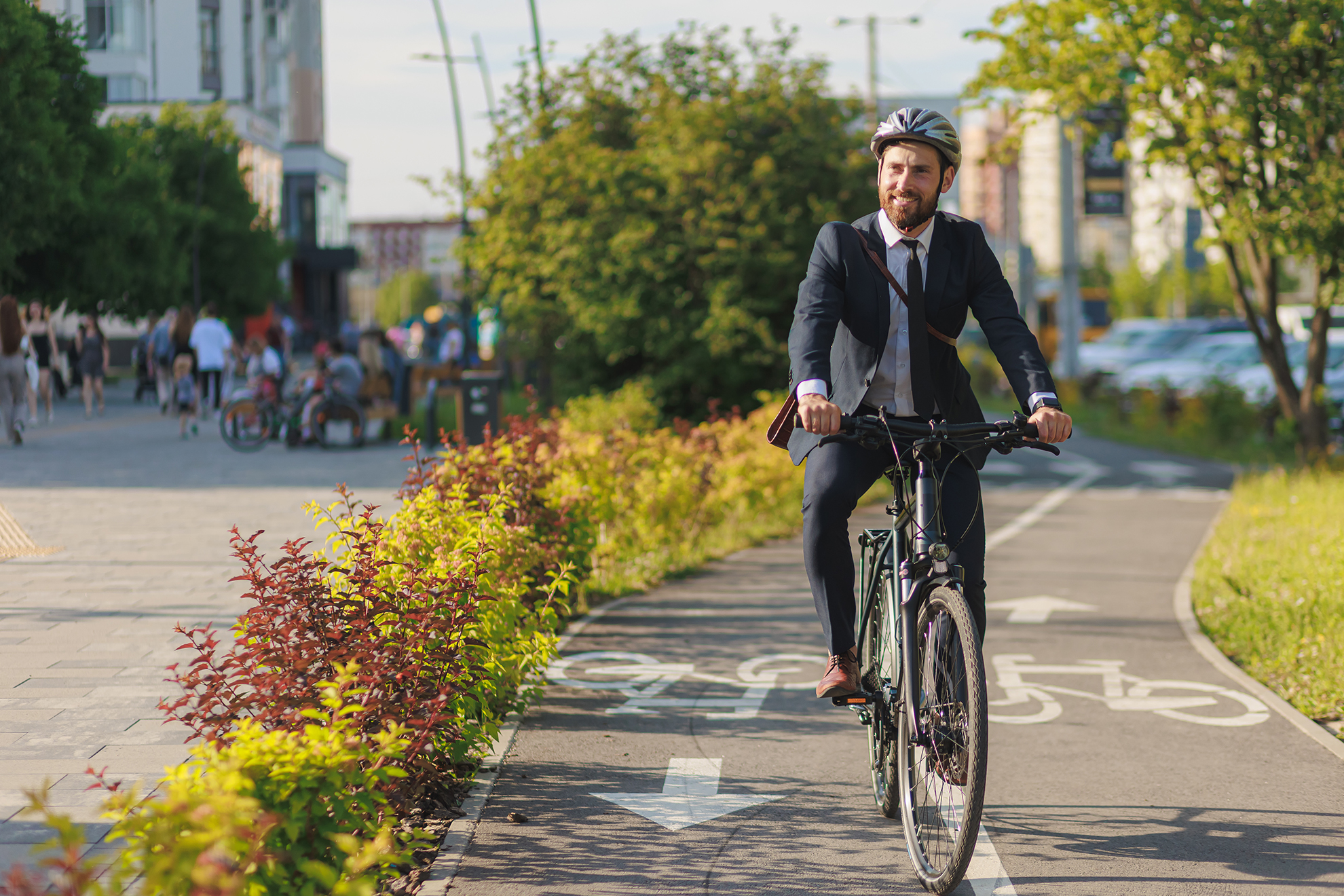 Mobile building manager riding his bike to the next commercial or residential building management site for performance facility management