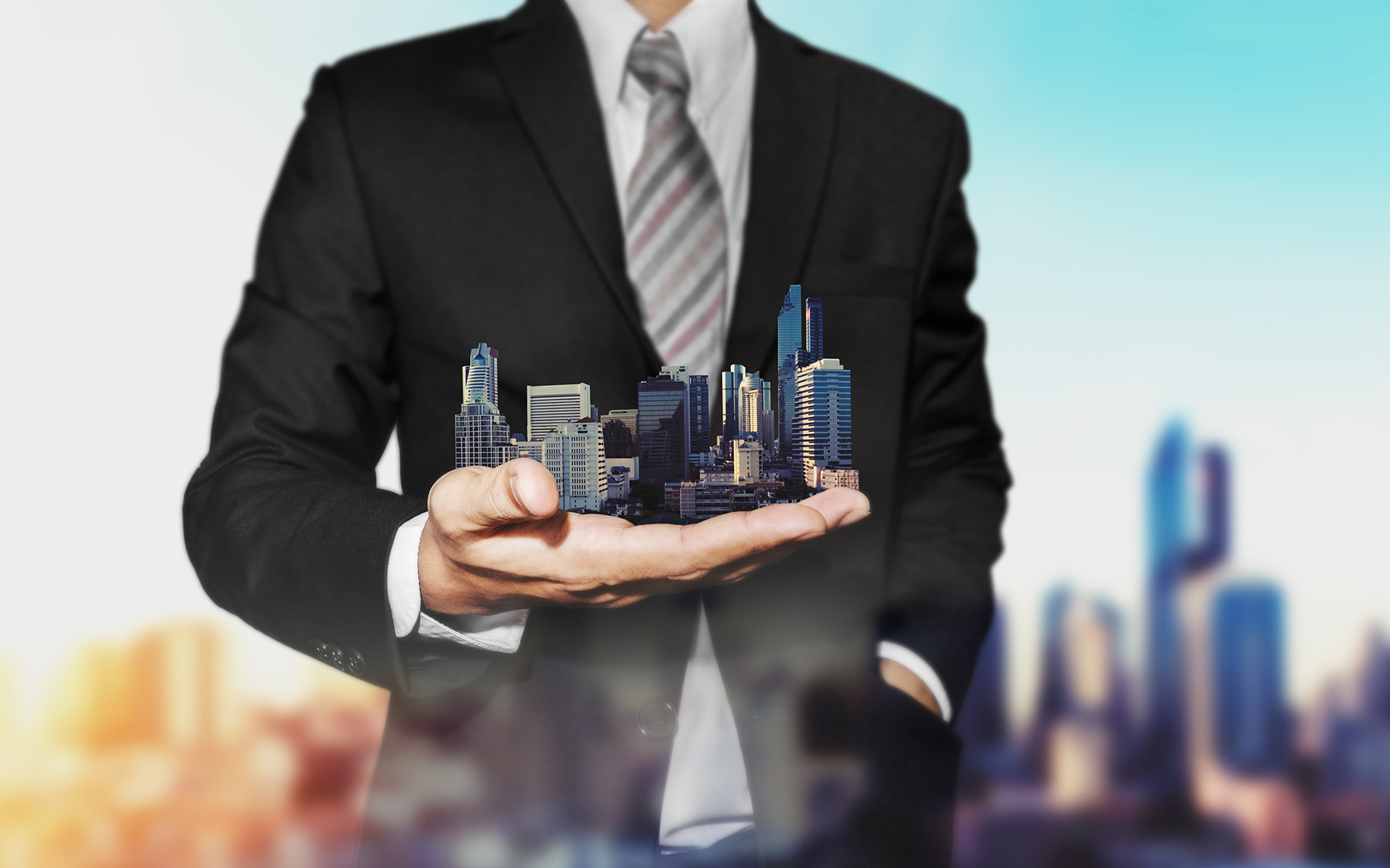 Melbourne Building Supervisor - Executive building manager or facility manager showing a model Melbourne CBD in the palm of his hand