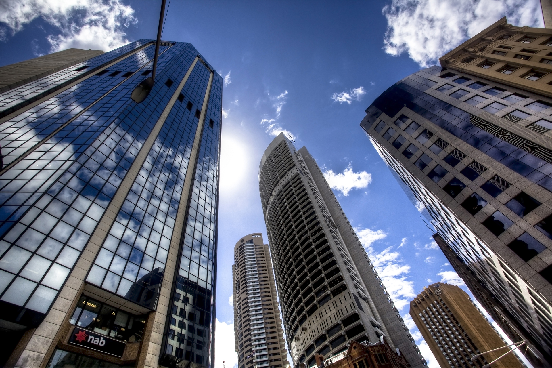 Sydney CBD commercial Property Office Buildings taken from the ground looking up at the sky with the sournding building on all sides