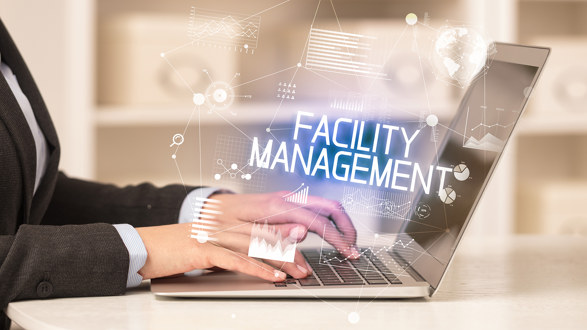 Outsource Facility Management - Facility Management executive at his laptop working through challenges of the day in a Melbourne Commercial Property Location