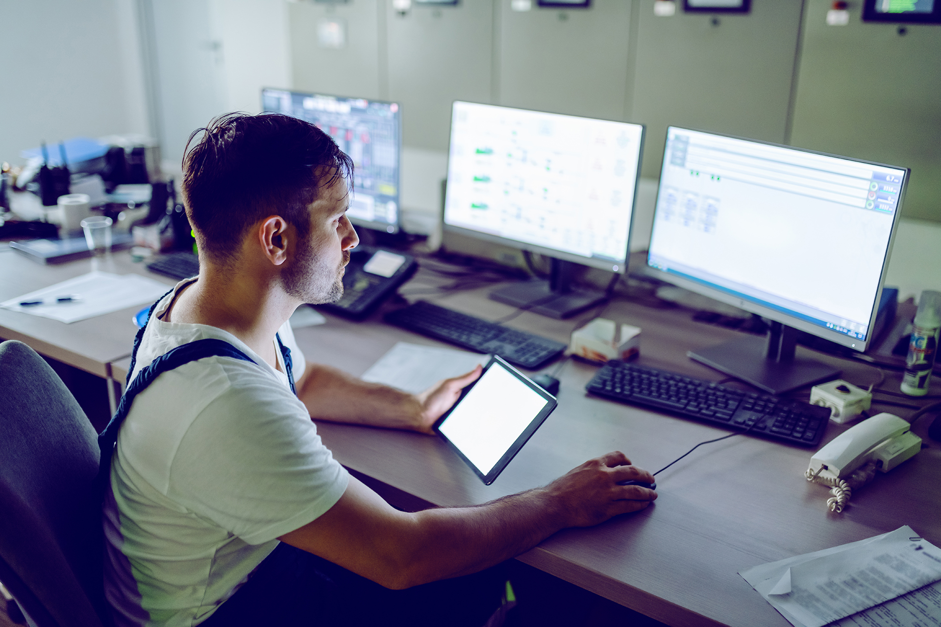 Performance Facility Management Field Employee performing checks on the BMS automation system for the building in line with the works completed on the HVAC air-conditioning System in Sydney