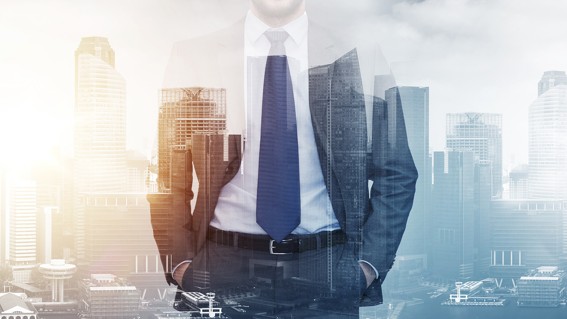 Sydney City CBD Skyline with the commercial Office buildings and an executive in front in a blue suit