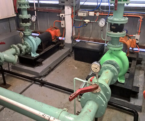Commercial Building maintenance - HVAC Mechanical services in the plant room of a Chatwood building showing condenser water pumps one and two both in operation and controlled by the building automation system, Sydney
