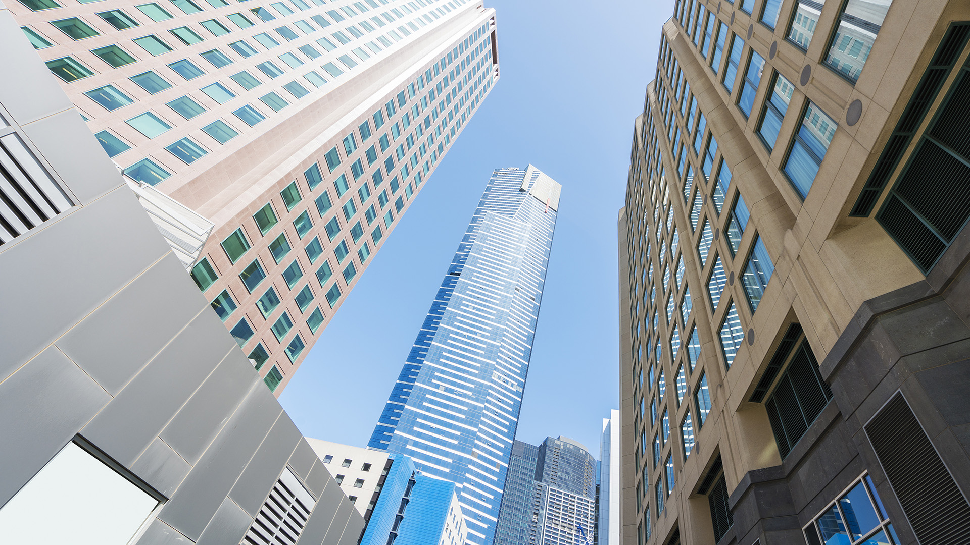 freshwater place melbourne from the street with 3 other buildings in the photo on a sunny day in Melbourne