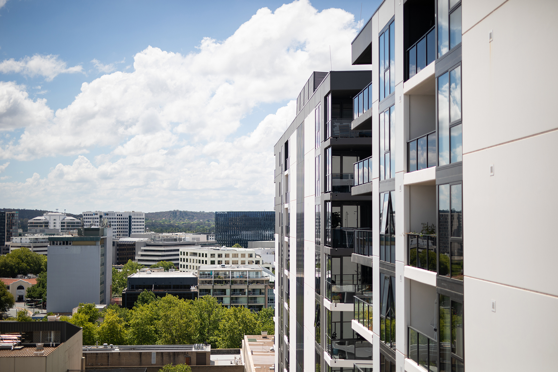 Building Audits in Canberra, Canberra Residential apartment block facing North, white facade, 7 storey high, great view
