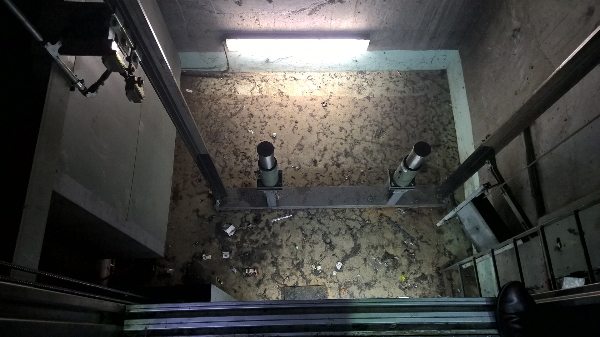 Elevator Pit flooded with water in car park post a huge April storm. We had to pump out and make dry for the elevator contractor to perform works and make repairs on the system. Water ingressed into the electrical system and the counnterweight pulley system. over $100,000 to repair.