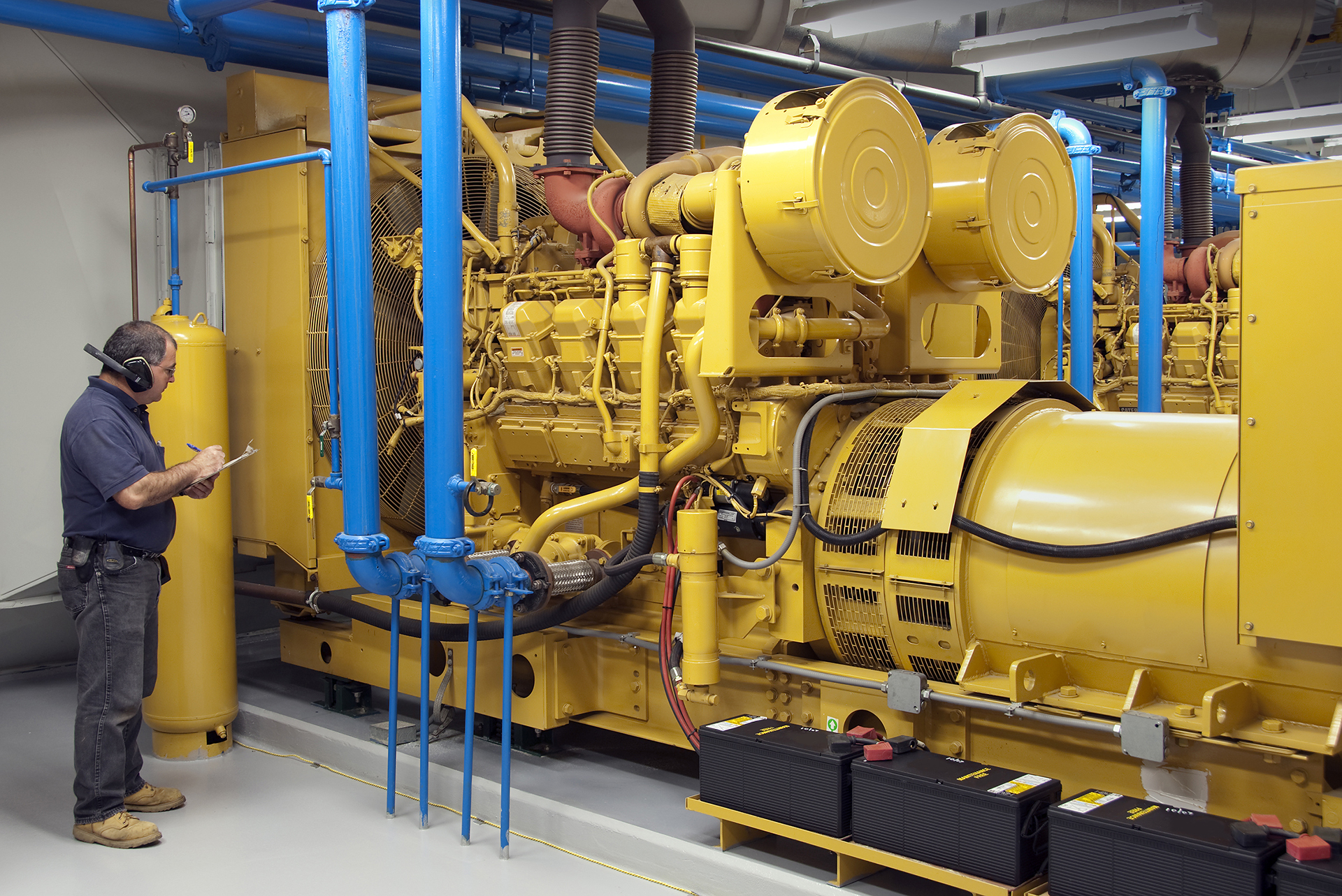 Essential Fire Services - 4000 + Kilowatt Generator being maintained and checked in Canberra Commercial Building Basement