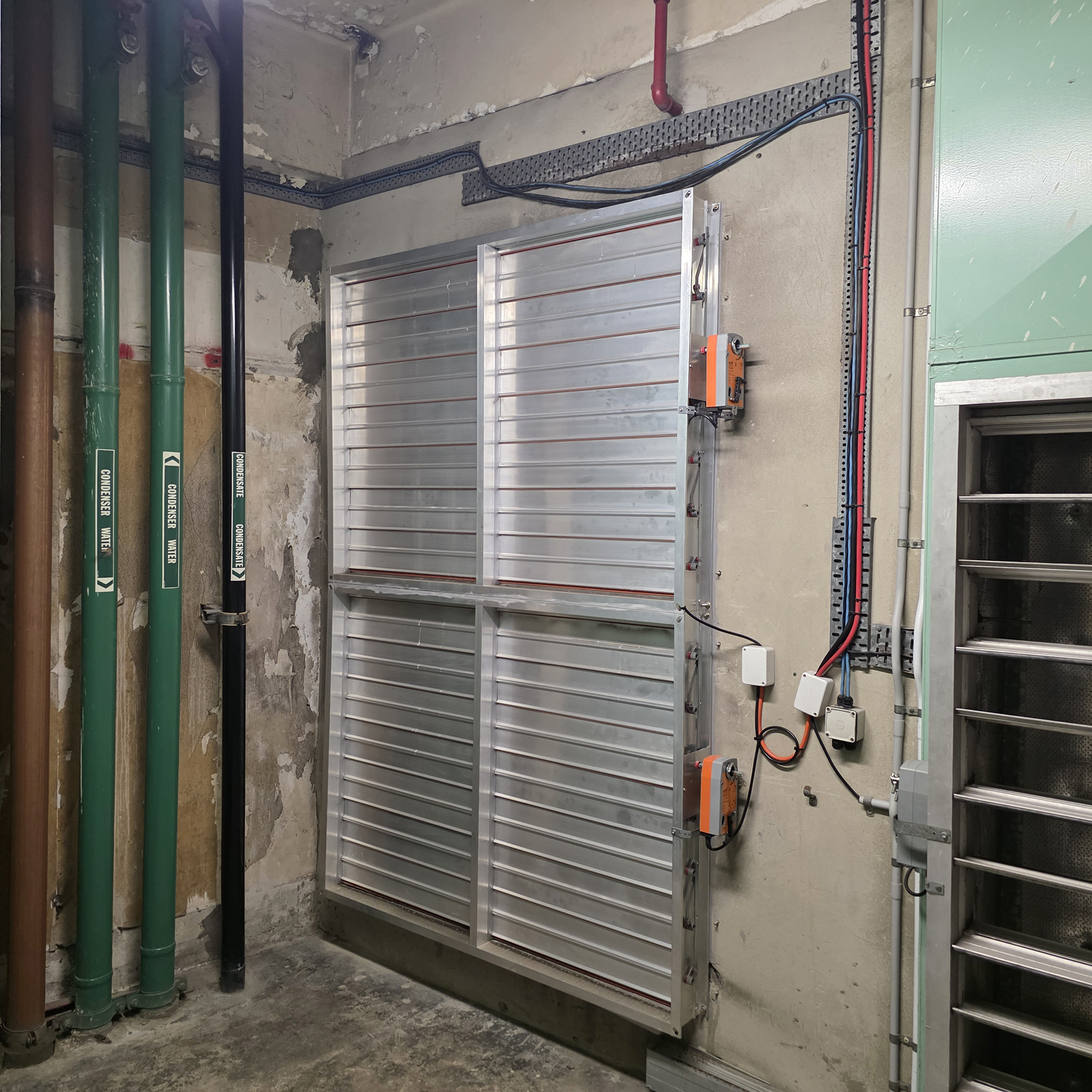 New damper modules fitted with Belimo BMS actuators in a Sydney commercial building.